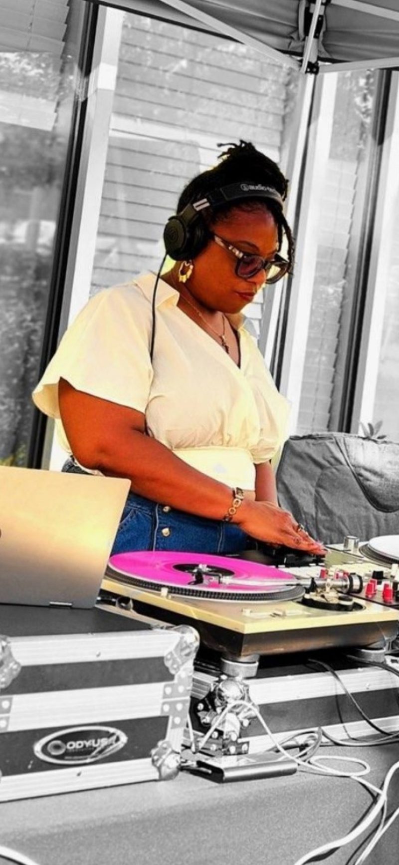 Sista Rhythm DJing at an outdoor event